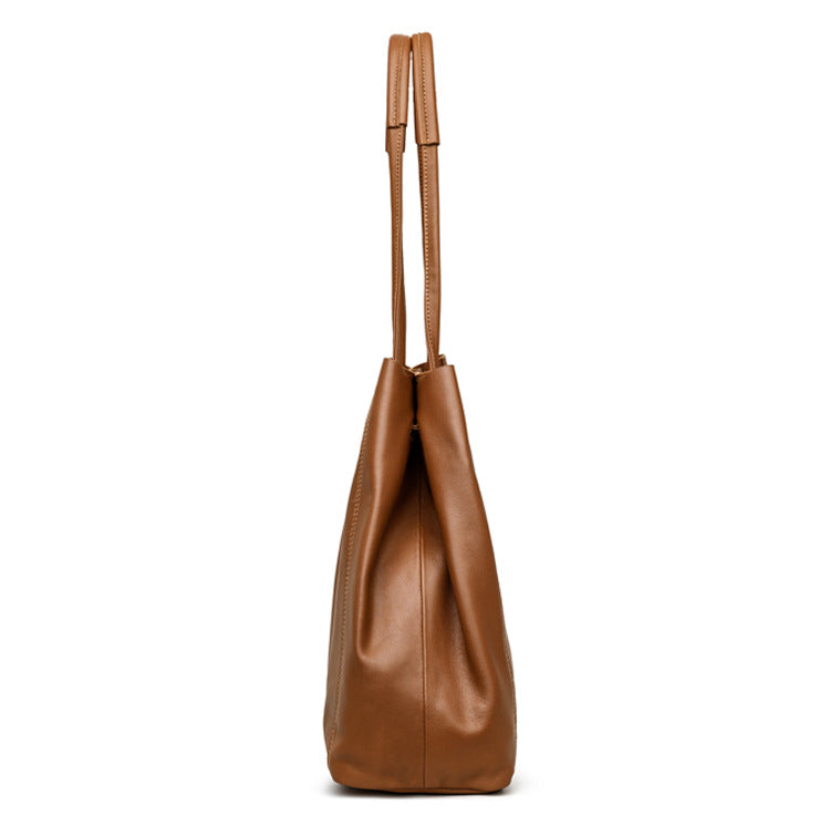 Brown leather handbag on a white background