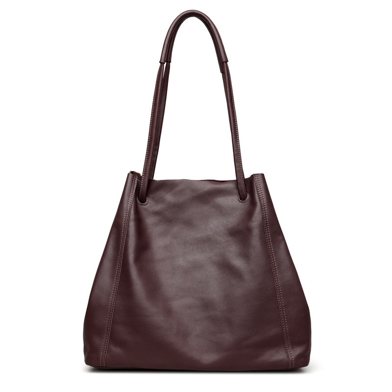 Brown leather handbag on a white background