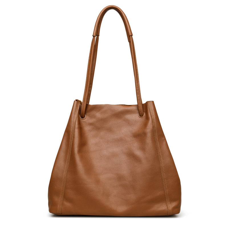 Brown leather handbag on a white background