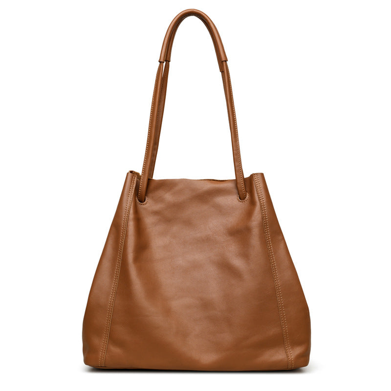 Brown leather handbag on a white background