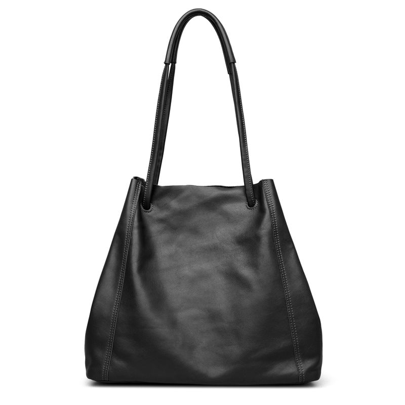 Black leather handbag on a white background