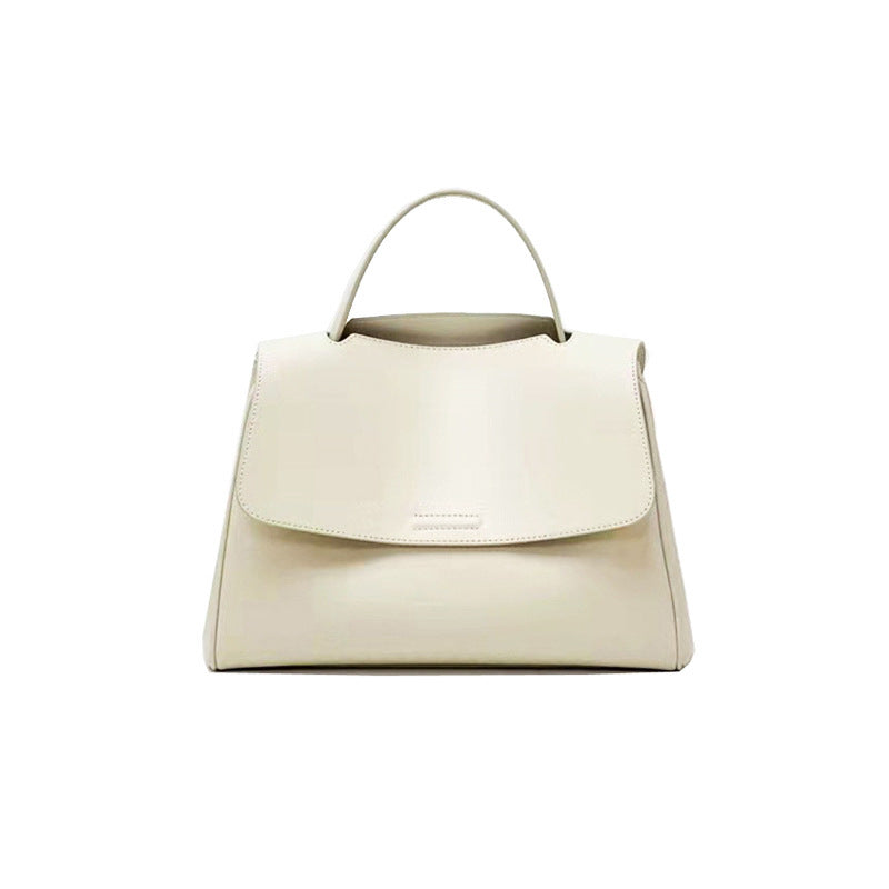 Flat lay of AETHEL minimalist vegan leather womens bag with neutral background